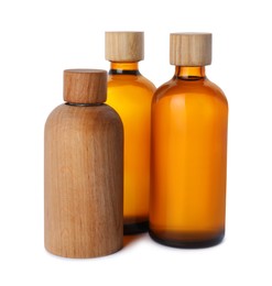 Different bottles of essential oil on white background