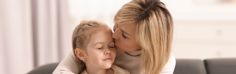 Image of Mother and her little daughter spending time together at home, banner design