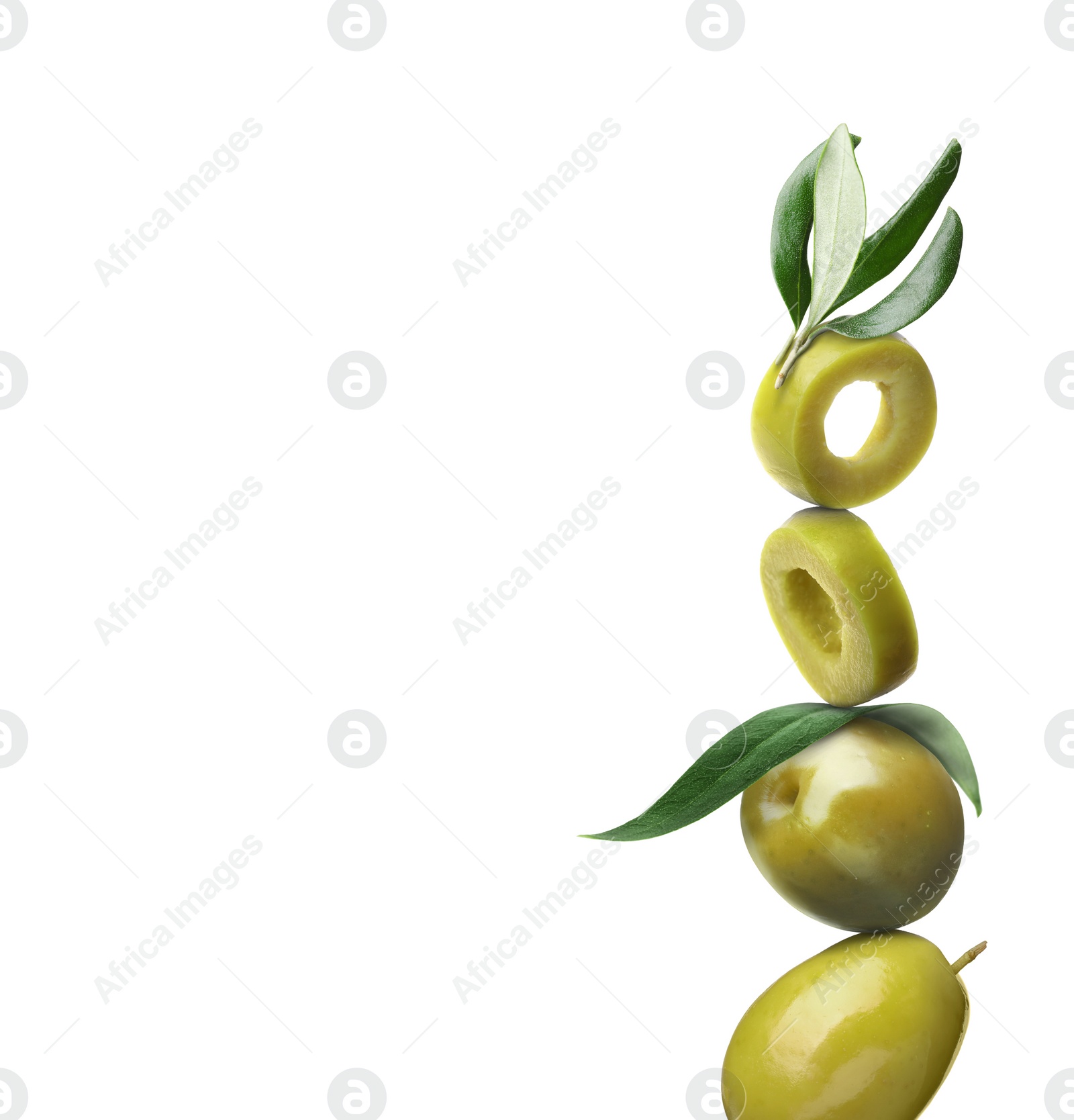 Image of Cut and whole green olives with leaves on white background