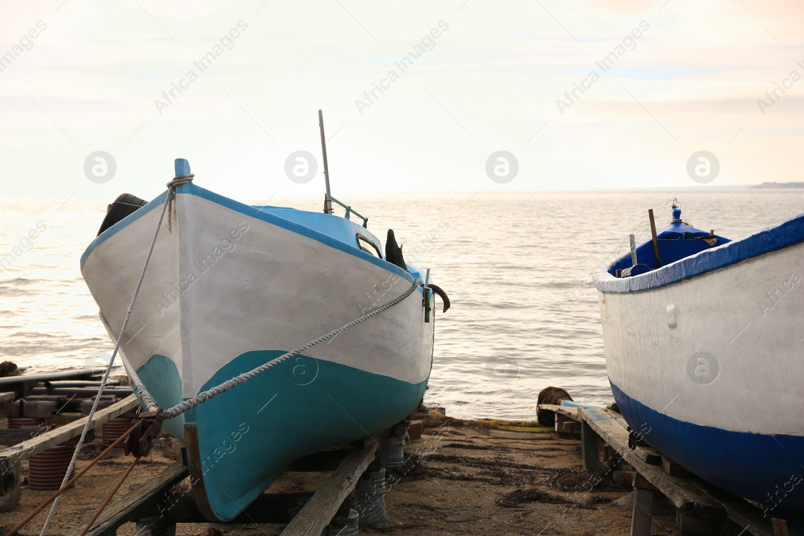Photo of Moored boats on beach near sea outdoors