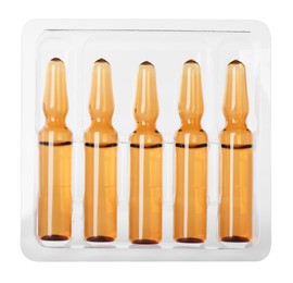 Photo of Glass ampoules with pharmaceutical product in tray on white background