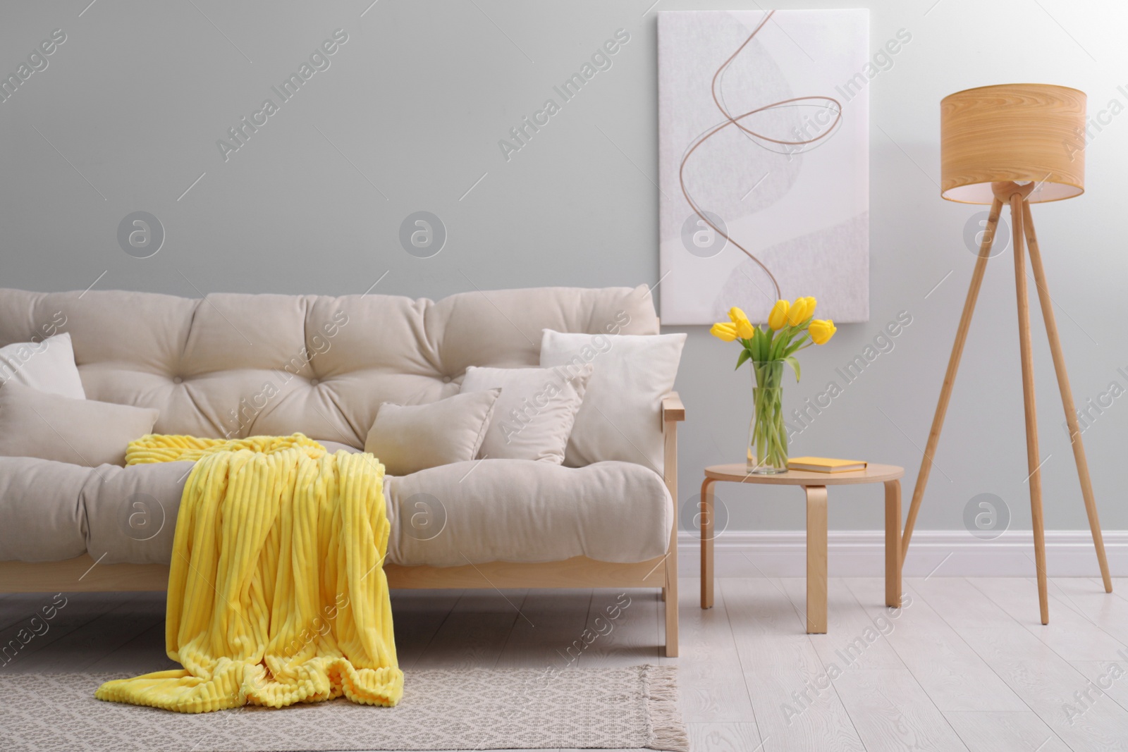 Photo of Comfortable sofa in stylish living room interior