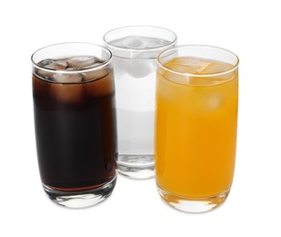 Photo of Glasses of different refreshing soda water with ice cubes on white background