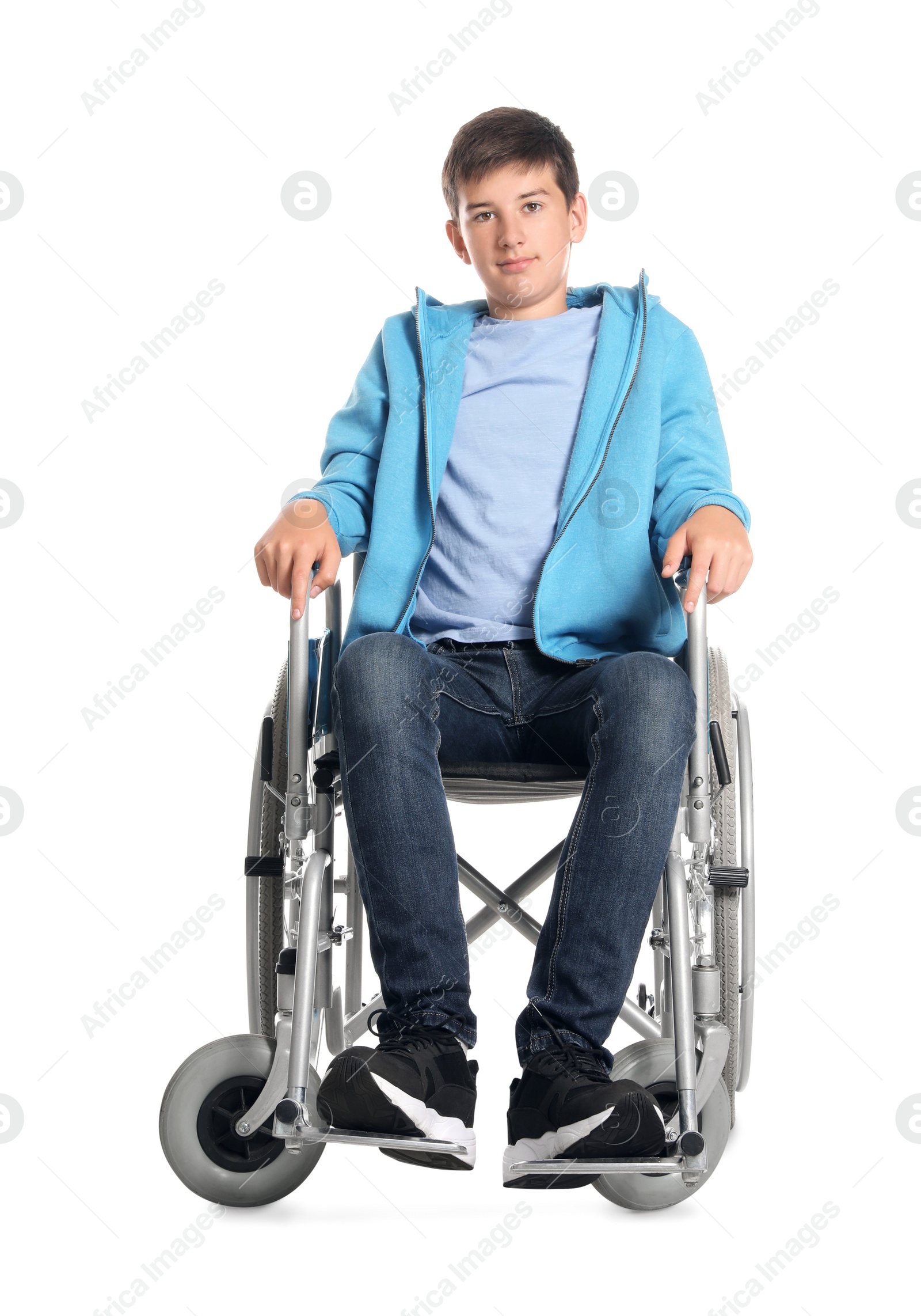 Photo of Teenage boy in wheelchair on white background