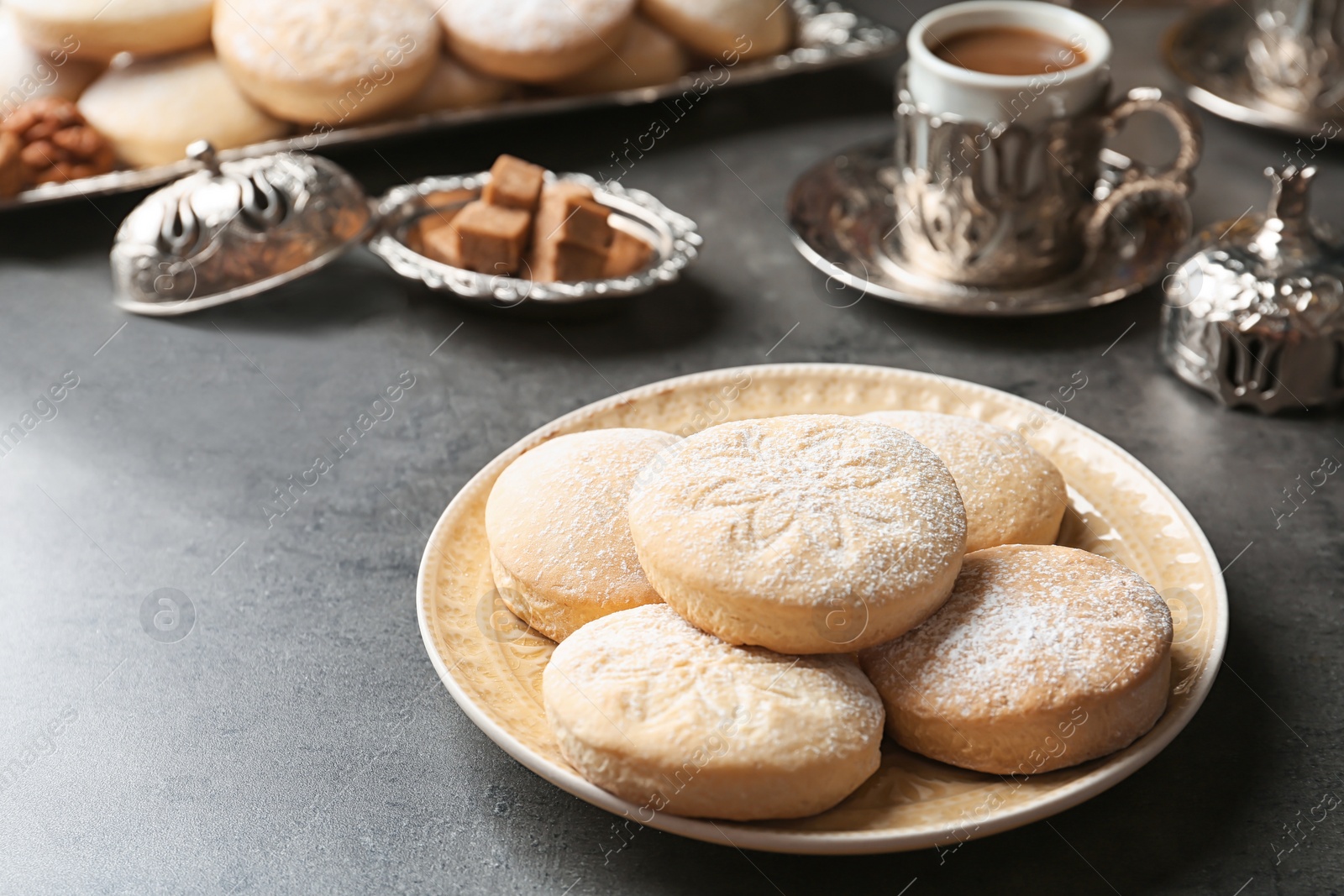 Photo of Composition with traditional Islamic cookies on table, space for text. Eid Mubarak