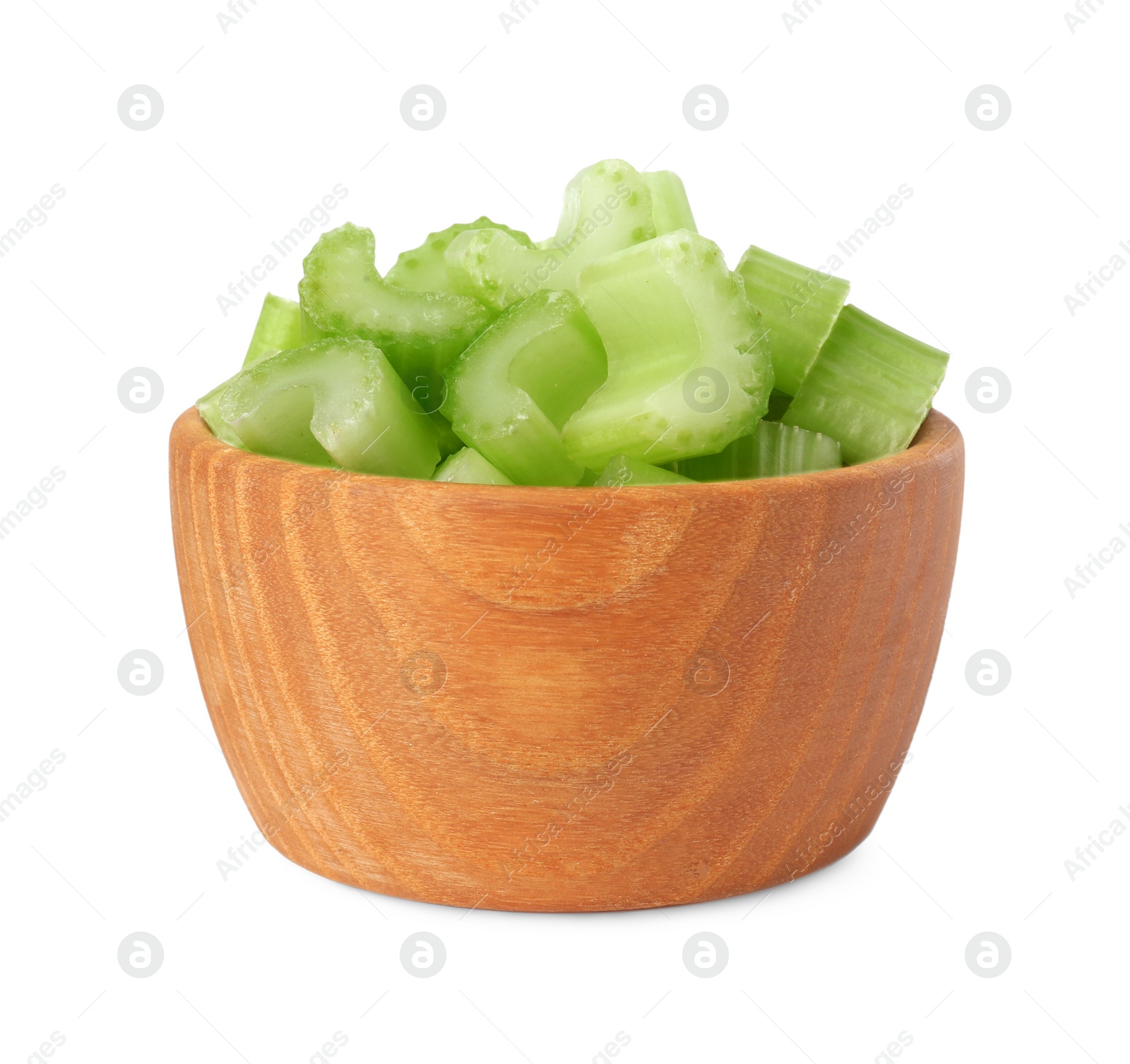 Photo of Wooden bowl of fresh cut celery isolated on white