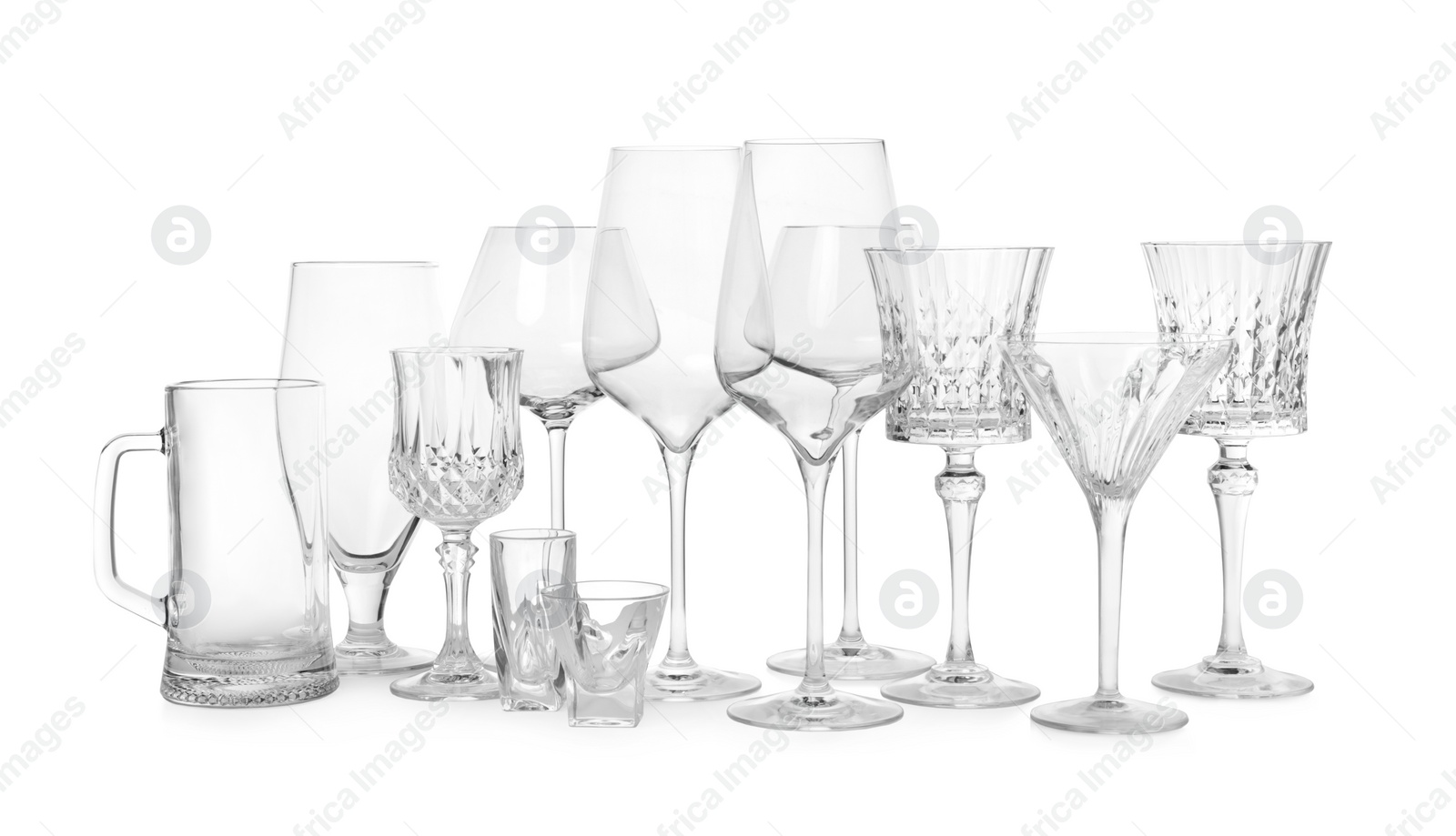 Photo of Different elegant empty glasses isolated on white