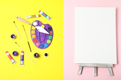 Flat lay composition with set of painting tools for children on color background