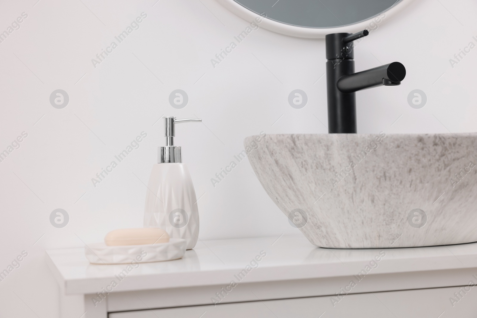 Photo of Different bath accessories and personal care products on bathroom vanity indoors