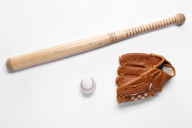 Baseball glove, bat and ball on white background, flat lay