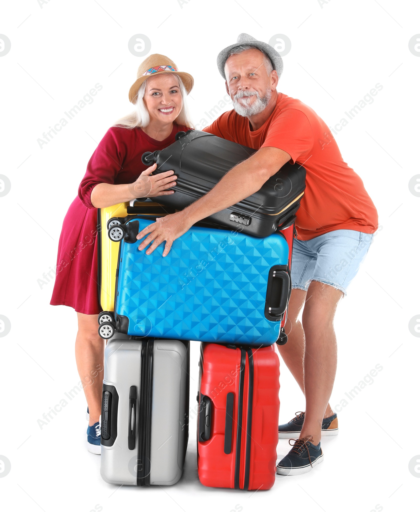 Photo of Senior couple with suitcases on white background. Vacation travel