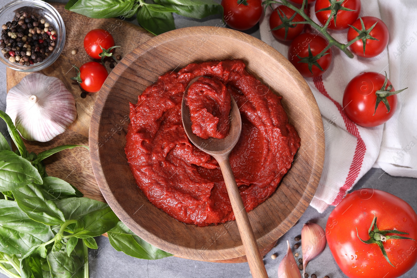 Photo of Tasty tomato paste and ingredients on table, flat lay