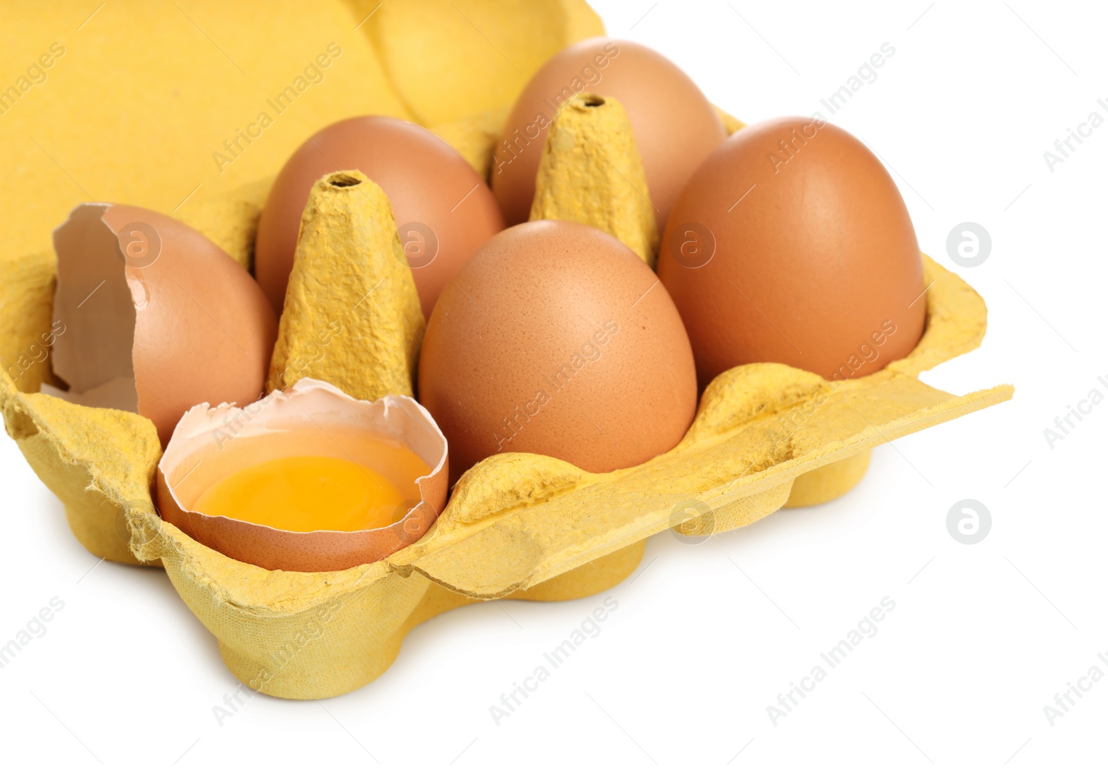 Photo of Chicken eggs in carton isolated on white