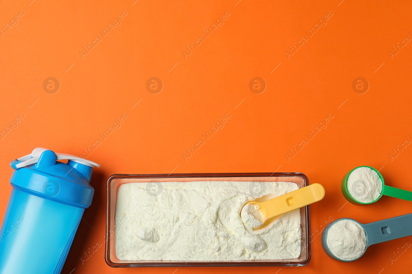 Photo of Flat lay composition with protein powder on color background. Space for text