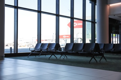 Photo of ISTANBUL, TURKEY - AUGUST 13, 2019: Waiting area with seats in new airport terminal