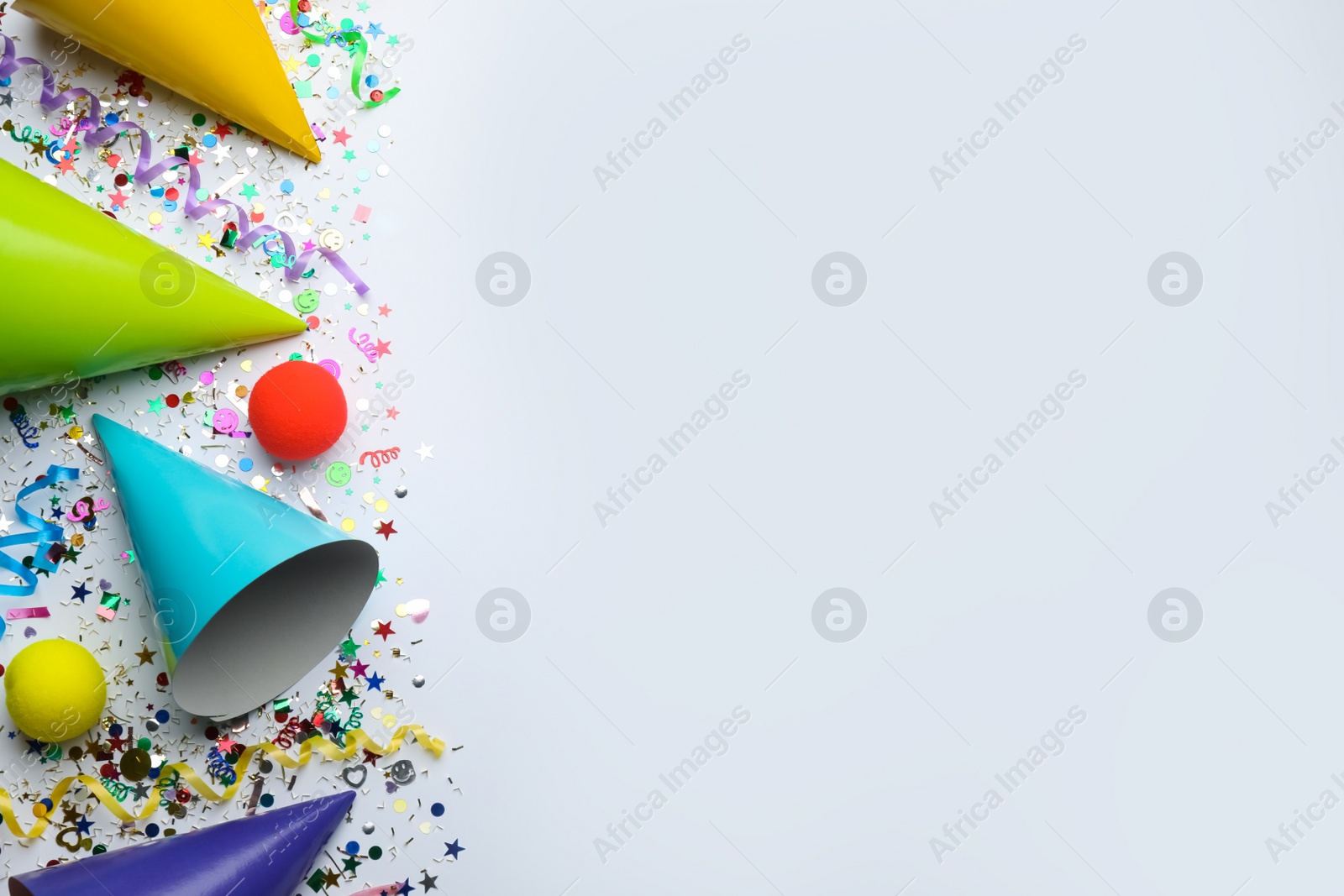 Photo of Beautiful flat lay composition with festive items on white background, space for text. Surprise party concept