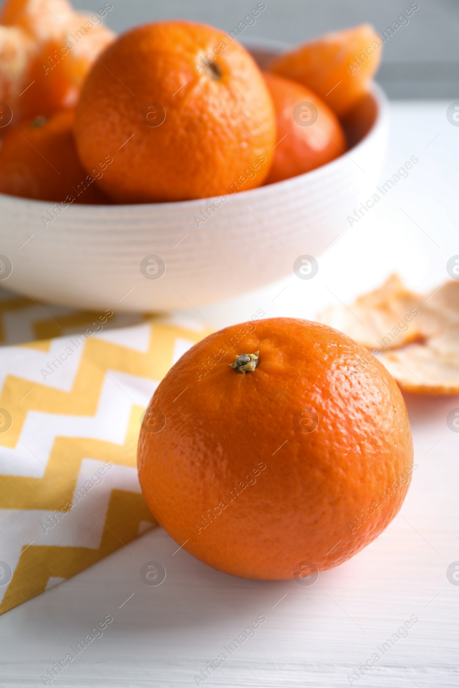 Photo of Delicious fresh ripe tangerine on white table