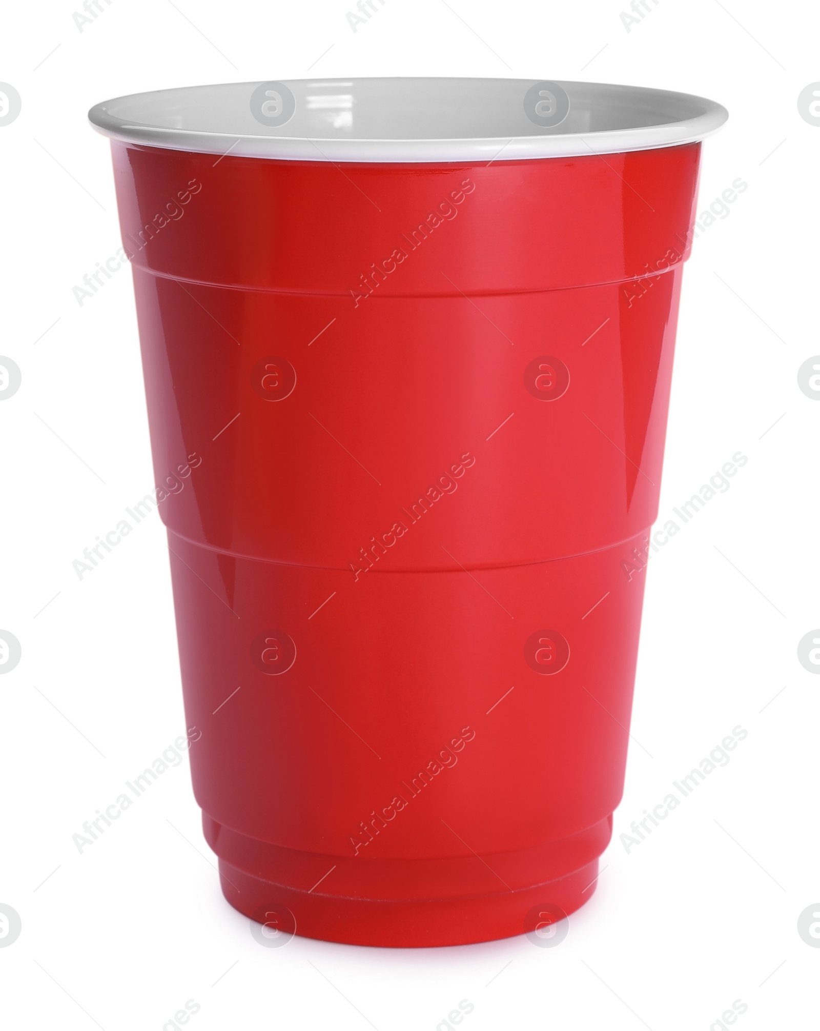 Photo of New red plastic cup on white background
