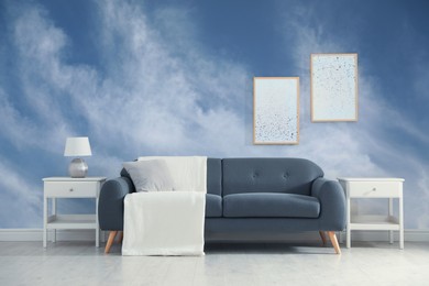 Image of Blue sky with clouds on wallpaper in furnished room. Beautiful interior design