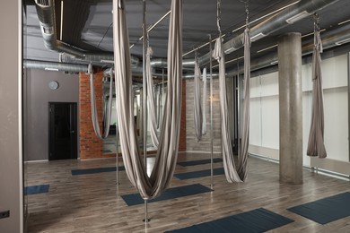 Photo of Many hammocks for fly yoga in studio