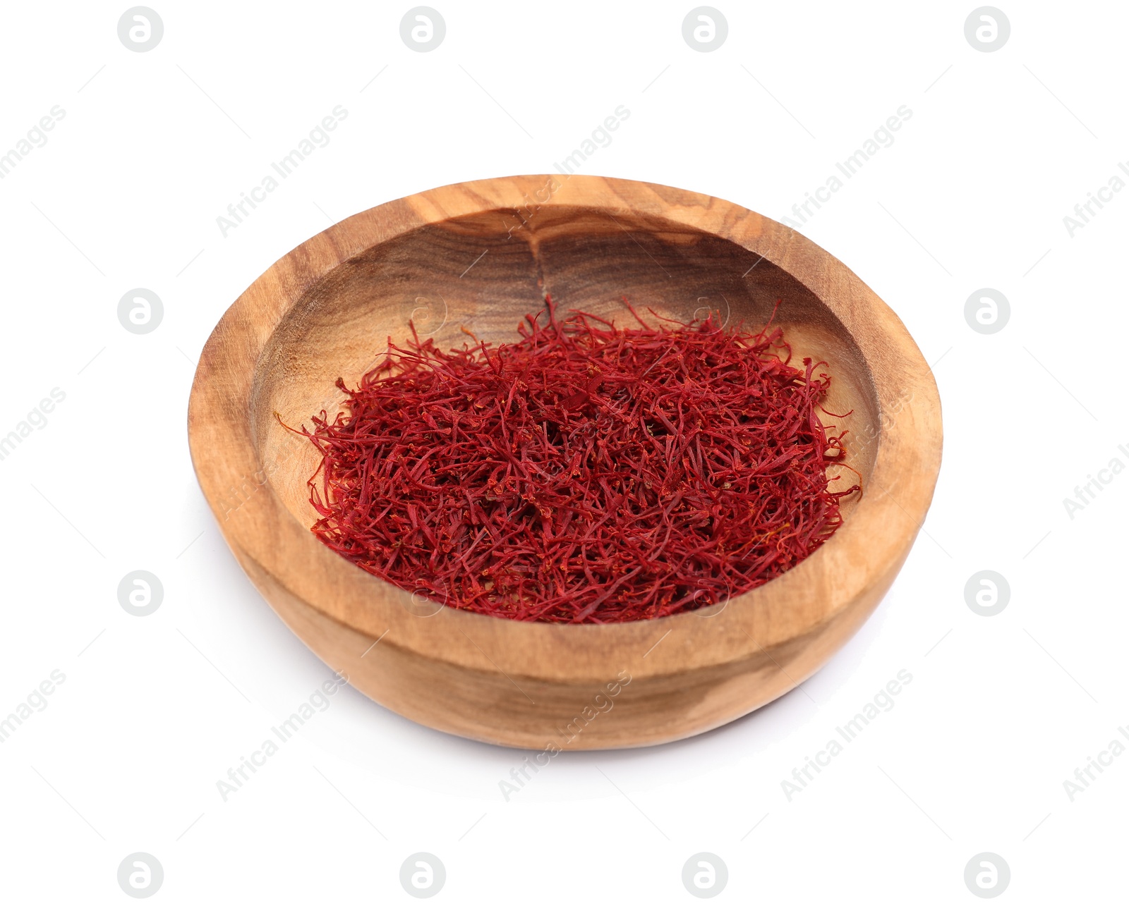 Photo of Aromatic saffron in bowl isolated on white