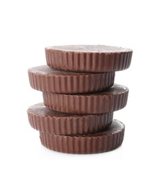 Delicious peanut butter cups on white background