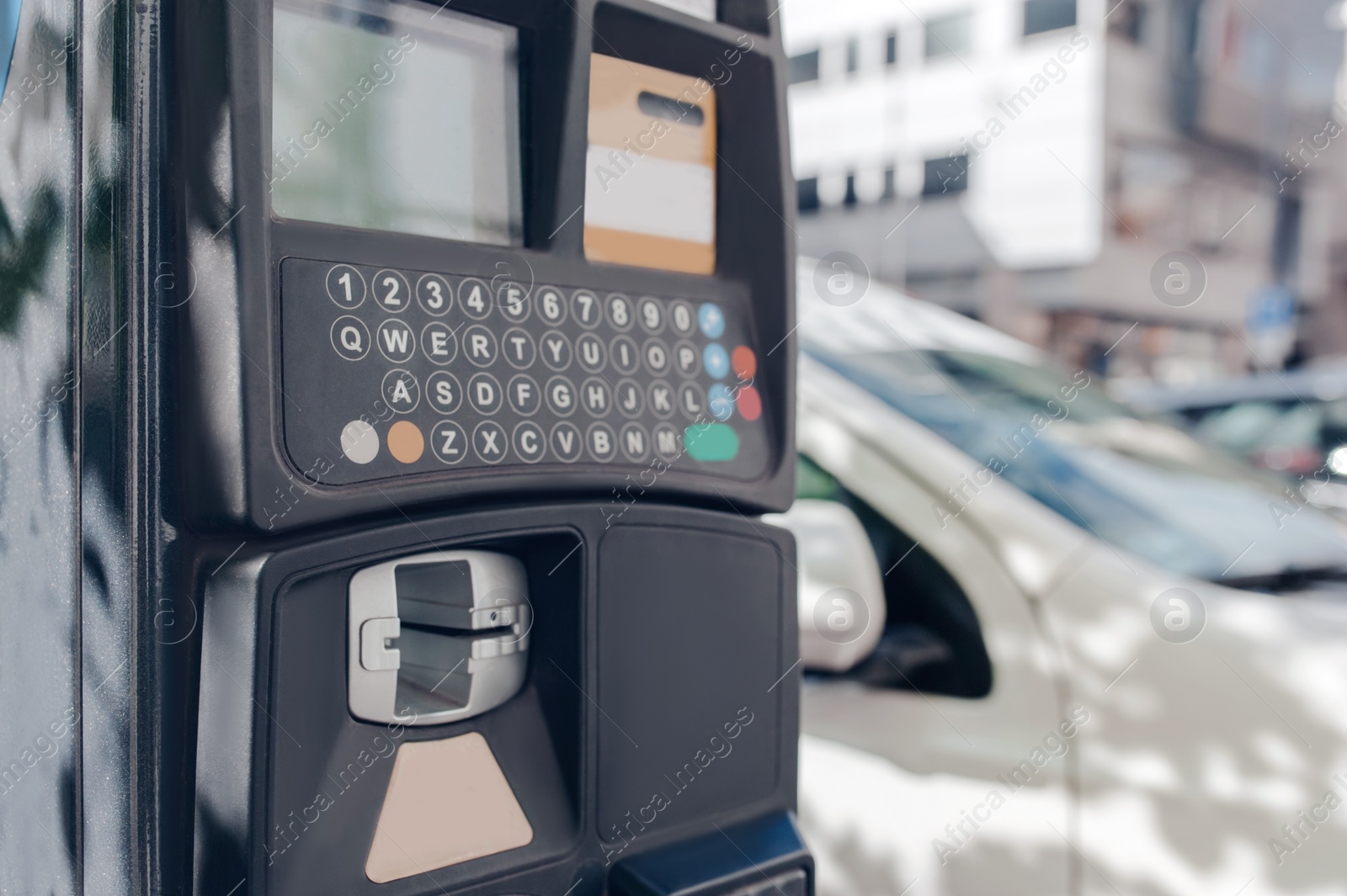 Photo of Modern parking meter on city street, closeup. Space for text