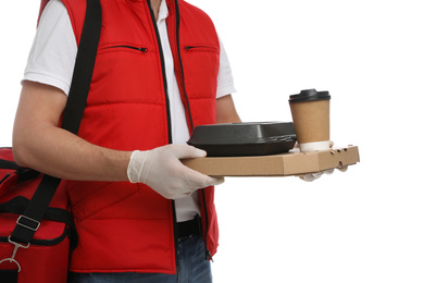 Courier in protective gloves holding order on white background, closeup. Food delivery service during coronavirus quarantine