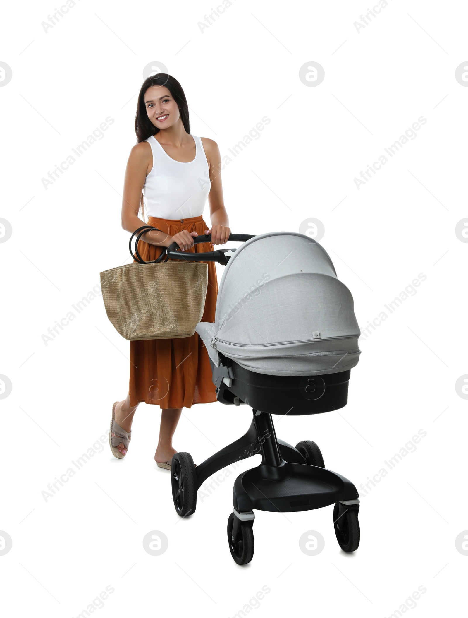 Photo of Happy young woman with baby stroller on white background