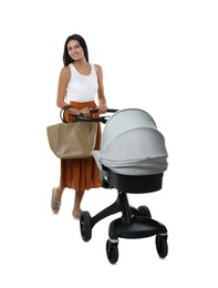 Photo of Happy young woman with baby stroller on white background