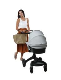 Happy young woman with baby stroller on white background