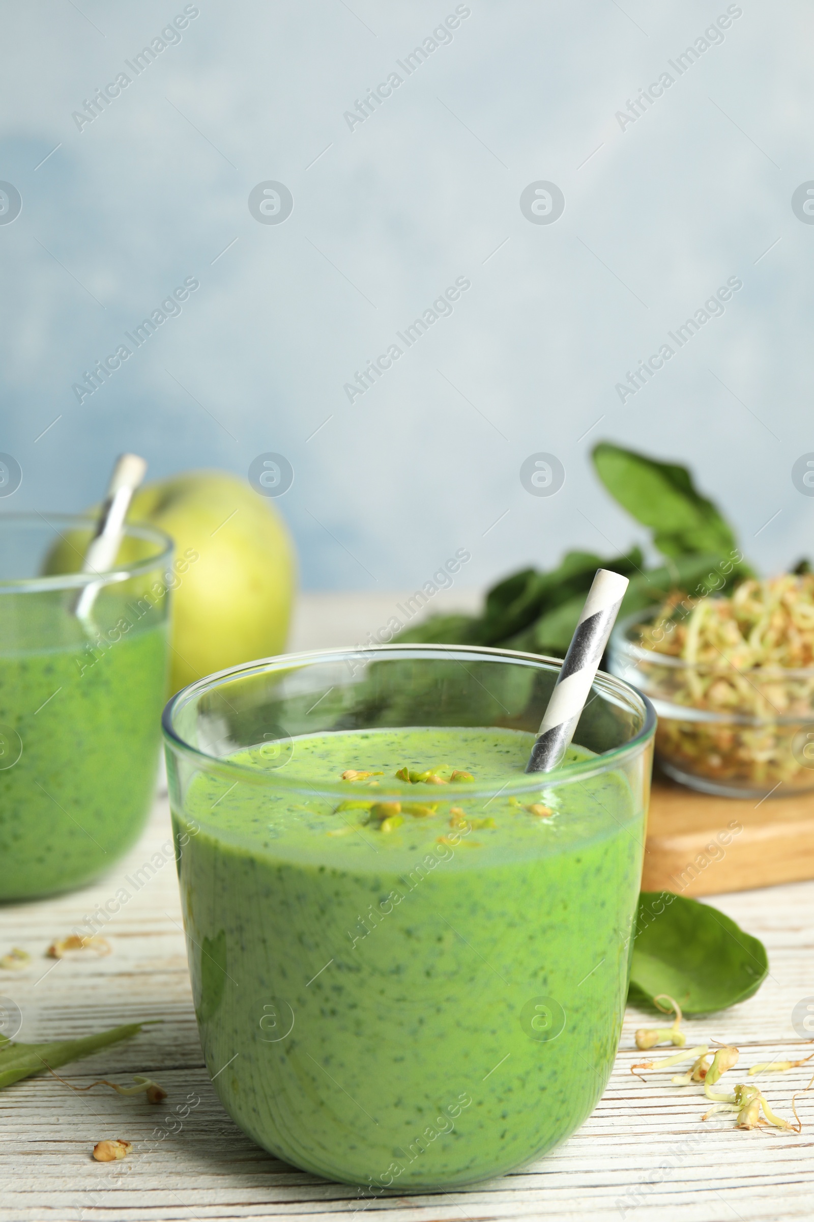 Photo of Green buckwheat smoothie on white wooden table