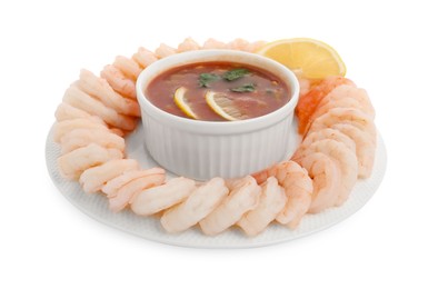 Tasty boiled shrimps with cocktail sauce and lemon isolated on white