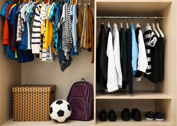 Photo of Large wardrobe with teenager clothes, shoes and accessories