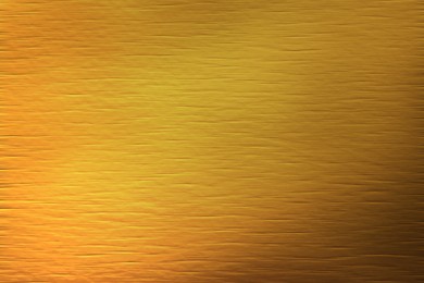 Image of Golden textured surface as background, closeup view