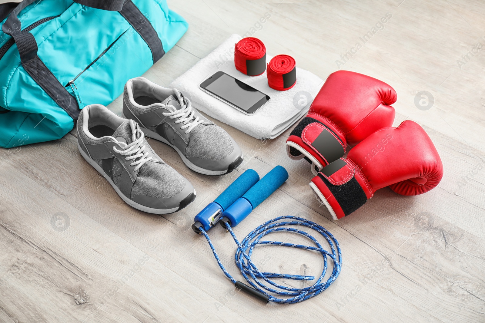 Photo of Composition with sports bag on wooden floor