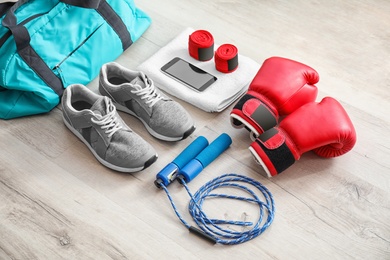 Composition with sports bag on wooden floor