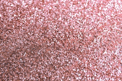 Photo of Texture of rose glitter fabric as background