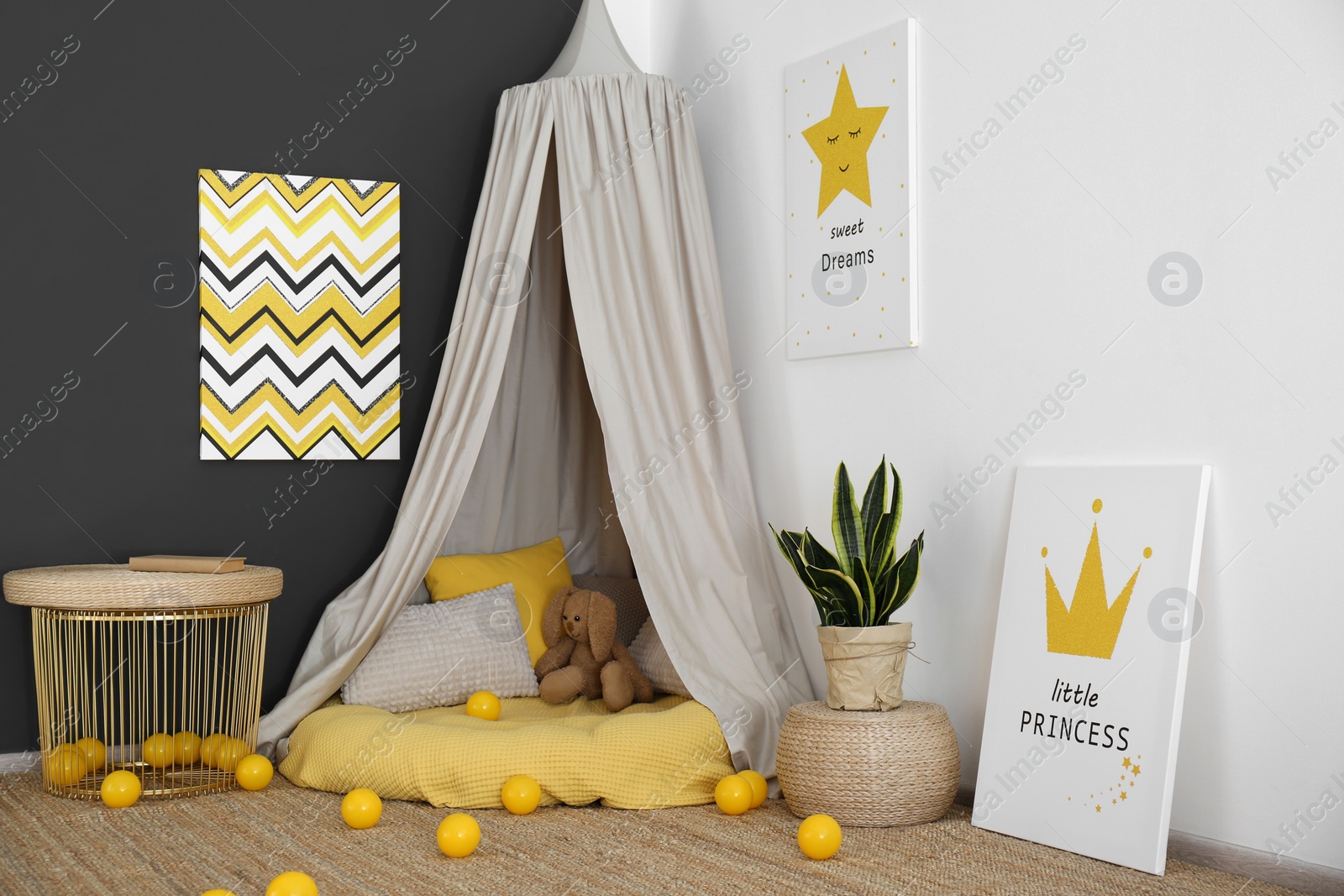 Photo of Baby room interior with play tent and cute posters