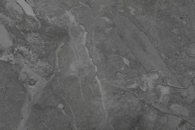Photo of Texture of dark grey marble surface as background, closeup