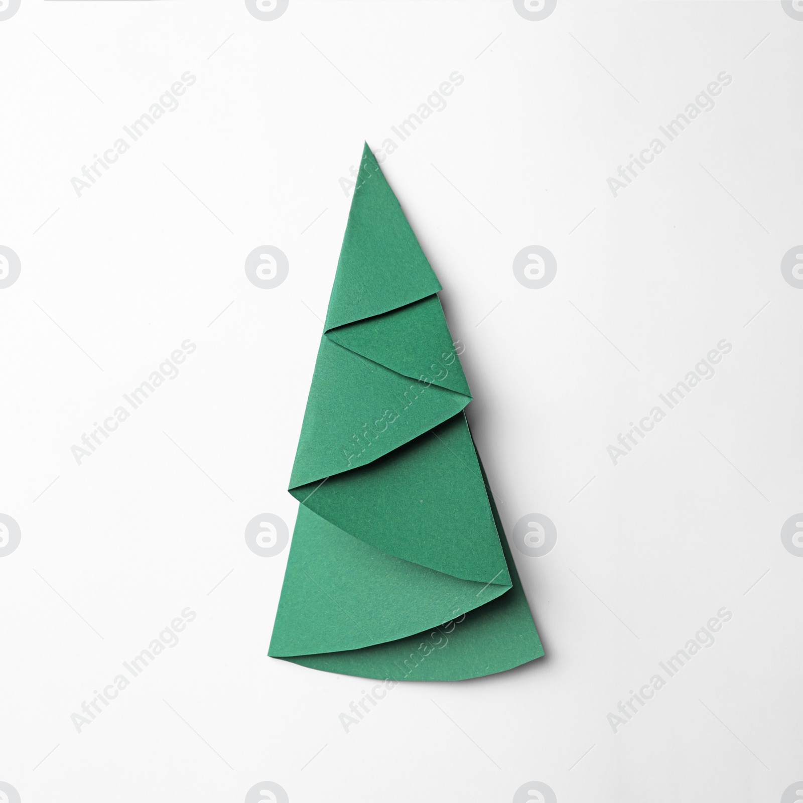 Photo of Christmas tree made of paper on white background, top view