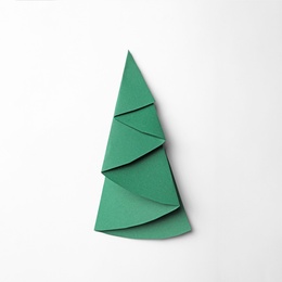 Photo of Christmas tree made of paper on white background, top view