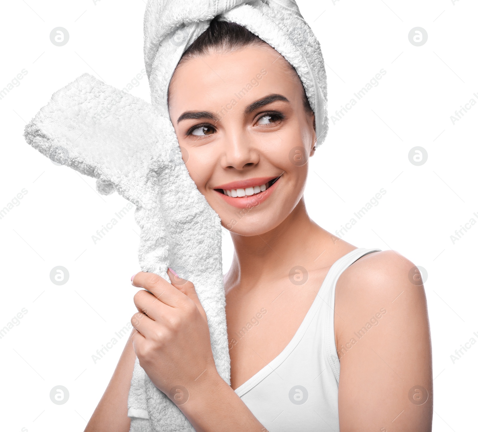 Photo of Happy young woman with towel on white background. Washing hair
