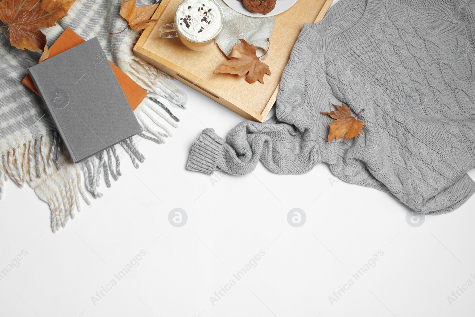 Photo of Flat lay composition with soft knitted sweater on white background