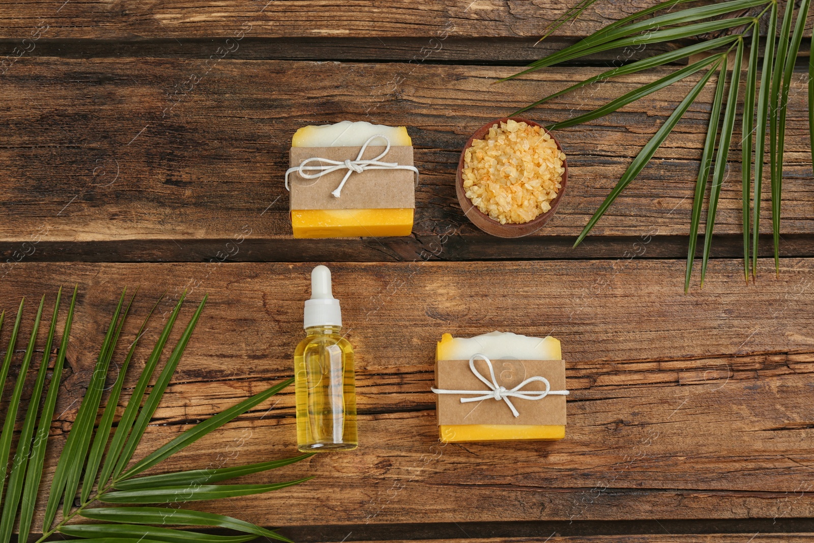 Photo of Flat lay composition with natural handmade soap on wooden background