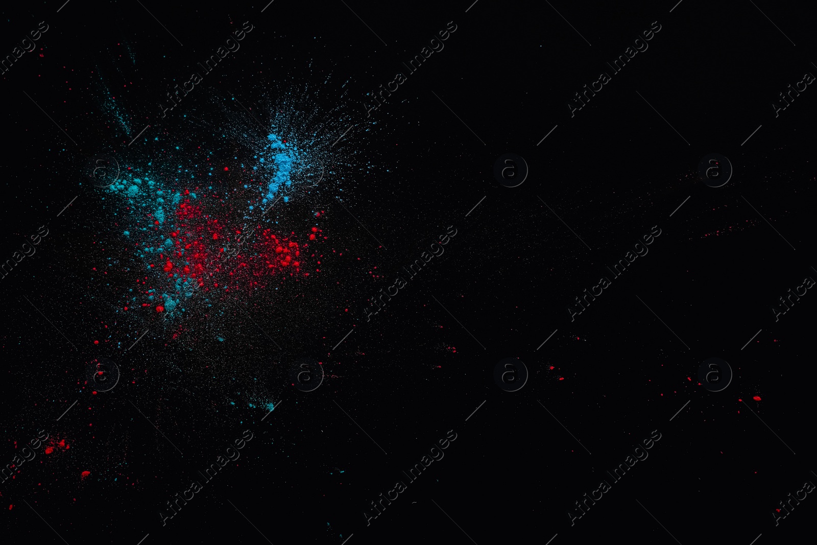 Photo of Colorful powder dyes on dark background, top view with space for text. Holi festival