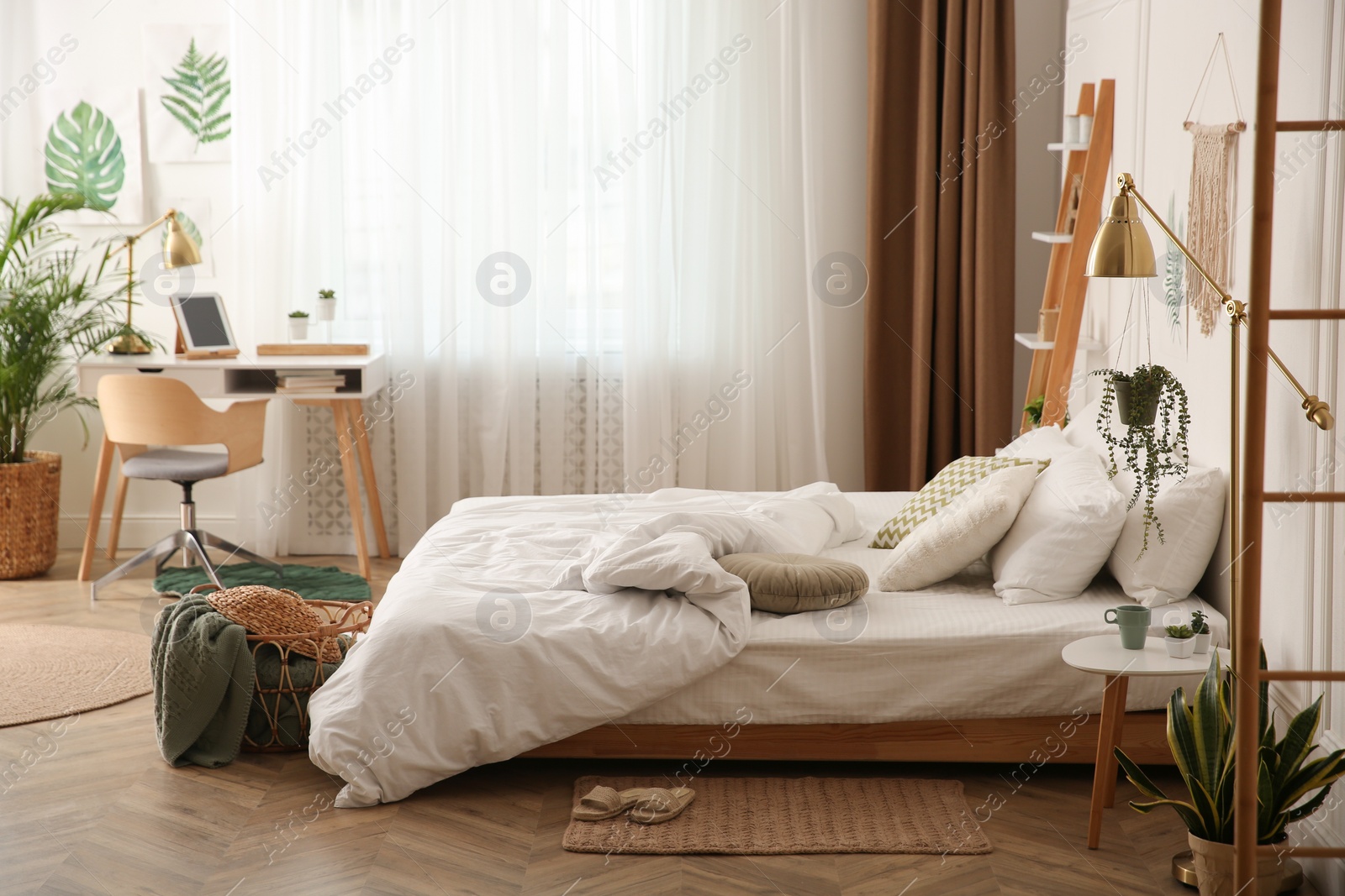 Photo of Modern bedroom with beautiful fresh house plants