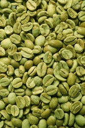 Photo of Many green coffee beans as background, top view