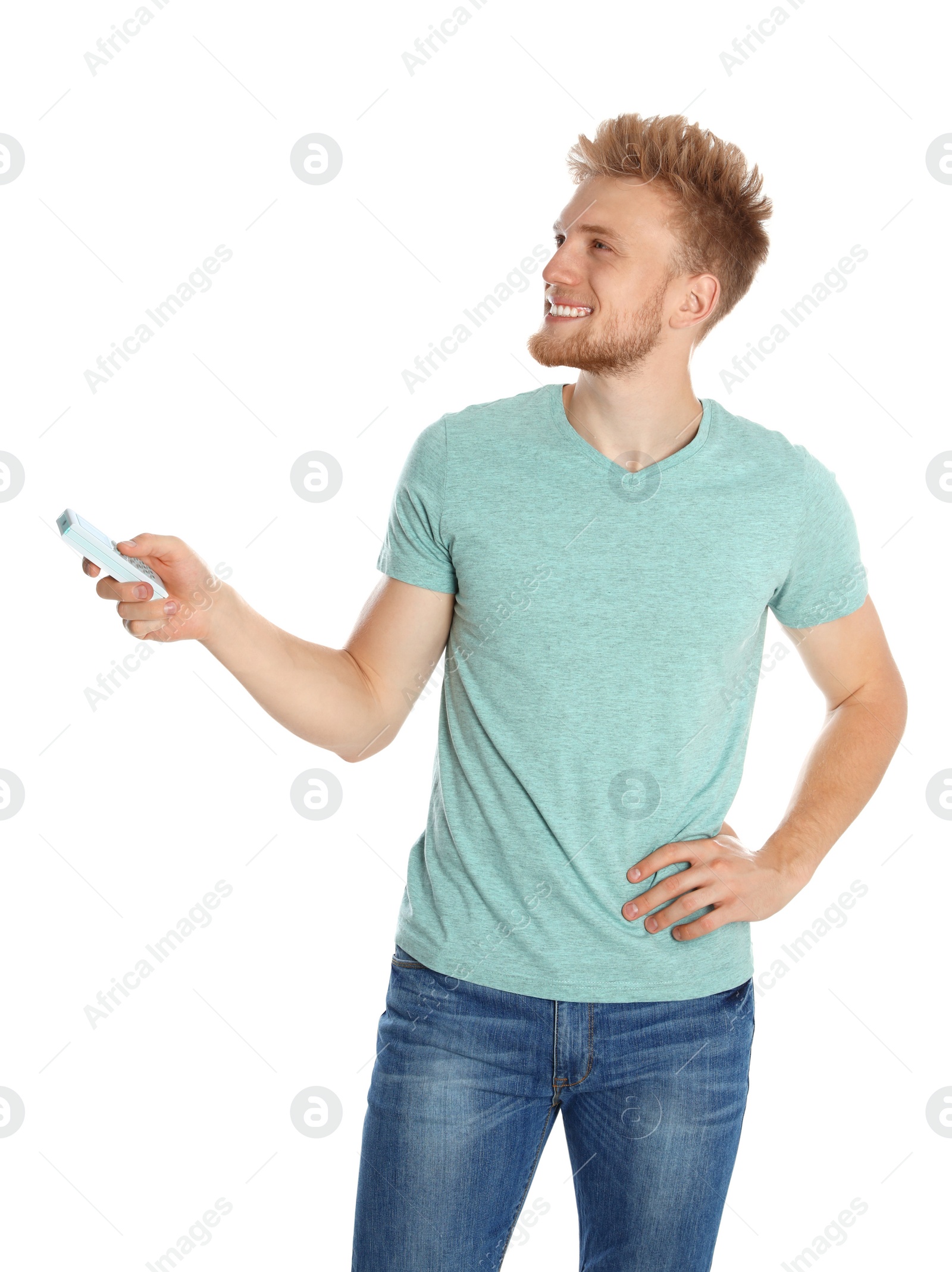 Photo of Young man with air conditioner remote on white background