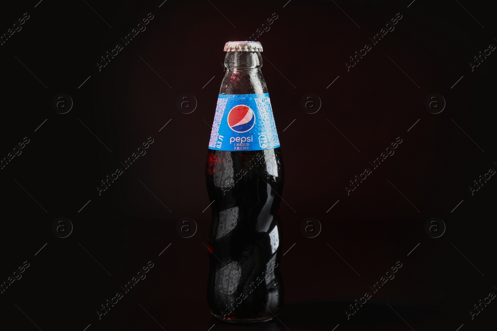 Photo of MYKOLAIV, UKRAINE - FEBRUARY 9, 2021: Bottle of Pepsi on dark background